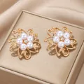 Elegant gold-plated flower earrings with white pearls and sparkling rhinestone centers - Pearl Gold