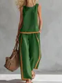 Full view of women's sleeveless green summer two-piece set with orange contrast trim - Green