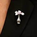 Creative silver flower vase brooch pinned on black suit lapel with purple flowers - Polished Silver Brooch (18-10739) / Bright Silver