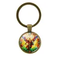 Vintage bronze keychain featuring an Archangel Michael stained glass style cabochon pendant - St. Michael with Sword and Shield Style / Antique Bronze