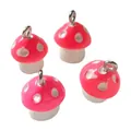 Detailed view of pink resin mushroom charms with white polka dots for jewelry making - Bright Pink