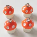 Set of four red and white spotted resin mushroom charms with silver loops for DIY jewelry - Coral