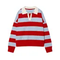 Detailed view of long-sleeved knit polo sweater with bold red and blue horizontal stripes. - S / Light Blue and Red Striped