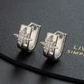 Elegant silver starburst hoop earrings with crystal inlay on black leather display - Silver Star U-shaped Hoop Style(K)