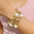 Detailed view of a trendy multi-layer gold wrap bracelet featuring elegant white pearls - 32781-bra-G-EP