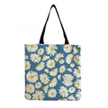 Close-up of blue tote bag with vibrant white and yellow daisy floral pattern - Light Blue with White Daisy Print (hm5197)