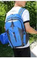 Large capacity blue outdoor hiking backpack being worn by a man in a nature setting - Blue