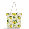 Detailed view of canvas beach tote featuring vibrant lemon print and sturdy rope handles - Lemon and Green Leaves Print (ms0644)