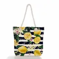 Front view of canvas tote bag featuring lemon and navy stripe pattern with rope handles. - Lemon and Blue Stripes (ms0649)