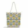 High-quality detail of a large beach tote bag with pineapple print and rope handles - Pineapple and Black/White Stripes (ms2018d)