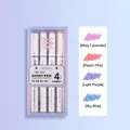 Set di 4 evidenziatori glitterati pastello con campioni di colore viola, rosa e blu. - Punta a scalpello / Fiori nella Nebbia