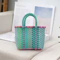 Handwoven color-blocked plastic tote bag in teal and pink mix - 23x17x6cm / Green Handle