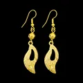 Elegant long gold leaf drop earrings featuring a unique textured sand gold finish design - Curved Leaf Style Earrings