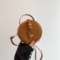 Fashionable brown round crossbody bag with quilted chevron texture and gold buckle - Brown