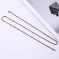 Detailed view of a rose gold stainless steel rope chain necklace with polished finish. - Rose Gold 3.0mm Thick / 60cm Long (braided Necklace)