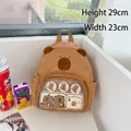 Adorable brown Capybara plush backpack featuring a clear pocket with cute illustrations - New Canvas Style (with 2 Badges)