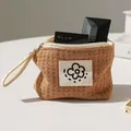Pochette cosmetica marrone in tessuto waffle con fiore - Marrone
