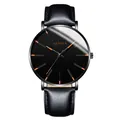 Close-up detail of a sleek black Geneva men's business watch featuring orange hour markers - Standard Size / Rose Gold Hands Black Case Black Leather Strap