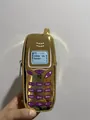 Trendy gold metallic telephone shaped mini crossbody pouch with Delete My Number print - One Size / Gold
