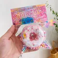 Adorable pink donut squishy toy in colorful blind bag packaging for stress relief - Ultra Soft Thickened High Quality / Large Donut Pink