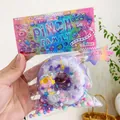 Cute purple donut squeeze toy with colorful glitter and beads inside packaging - Ultra Soft Thickened High Quality / Large Donut Purple