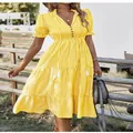 Yellow and white striped short sleeve V-neck dress with elastic waist and ruffles. - Yellow