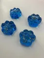 Four blue translucent cat paw squishy toys with decorative gold foil flakes inside - Cat Paw Style / Sapphire Blue