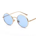 Retro round metal sunglasses featuring a sleek gold frame and light blue lenses. SKU. - Gold Frame Blue Lens