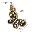 Detailed stainless steel butterfly charm pendant with black dripping oil design - Black Enamel Butterfly (BXGPJ180)