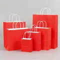 Set of various sized red kraft paper gift bags with white twisted paper handles - Bright Red; Extra Small Size (12*15*6) In Vertical Style.