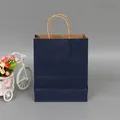 Premium navy blue kraft paper gift bag with durable twisted handles for retail and shopping - Navy Blue; Extra Small Size (12*15*6) With Vertical Cut.