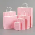 Set of premium pink kraft paper gift bags with sturdy white handles in various sizes - Pink; Extra Small Vertical Style (12*15*6)