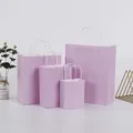 Light purple paper gift bags with white rope handles shown in four various sizes - Macaroni Purple; Vertical Style Extra Small Size (12*15*6)
