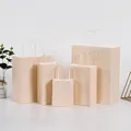 Set of beige kraft paper gift bags with white handles in various sizes for shopping - Maca Apricot; Vertical Style Extra Small Size (12*15*6)