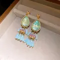 Detailed view of vintage court style waterdrop earrings with crystals and tassels - Tassel Style / Gold-Blue