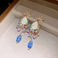 Detailed view of vintage court-style teardrop earrings featuring colorful crystals and beads - Tassel Style / Gold-Multicolor