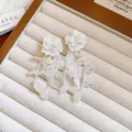 Elegant French style white floral tassel drop earrings with delicate resin petal charms - Shell Style / White