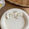 Elegant white fabric flower stud earrings with central pearl in French chic style. - White