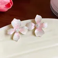 Detailed view of fresh pink gradient flower stud earrings with glitter enamel - Silver Earring Post Style / Pink