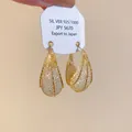 Elegant gold-tone mesh hollow moon-shaped hoop earrings featuring shimmering crystal accents - Silver Needle / Gold