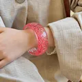 Stylish pink translucent resin bangle bracelet with internal sparkling glitter shards for women - Orange