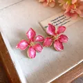 Elegant pink enamel flower stud earrings with gold-tone finish for a sweet vacation style - Tops / Pink