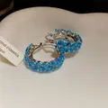 Close-up detail of vintage wheat hoop earrings featuring sparkling blue zircon stones - Ear Buckle / Silver-Blue