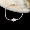 Luxury 18k gold-plated Hamsa hand charm bracelet with pavé-set sparkling cubic zirconia - Hamsa Hand Style (HB5292) / Gold