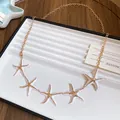 Detailed view of white and gold starfish charms on a retro ethnic style waist chain belt - Style 25