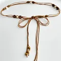Close-up of ethnic style multi-layer brown cord waist chain with decorative beads - Style 28