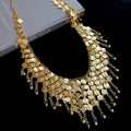 Detailed view of vintage gold coin charms on a multi-layer ethnic body chain. - Style 29