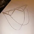 Close-up detail of silver metal frame glasses with sparkling rhinestones and hanging chains - Inverted Triangle Tassel Style