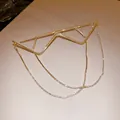 Detailed view of a gold geometric metal eyeglass frame with sparkling rhinestone chains. - Mountain Peak Geometric Style