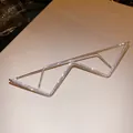 Close-up of a silver-toned metal lensless eyewear frame with rhinestone accents. - Zig-Zag Sawtooth Style